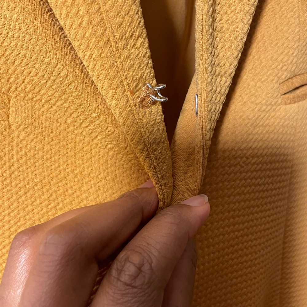 Mustard color jacket.